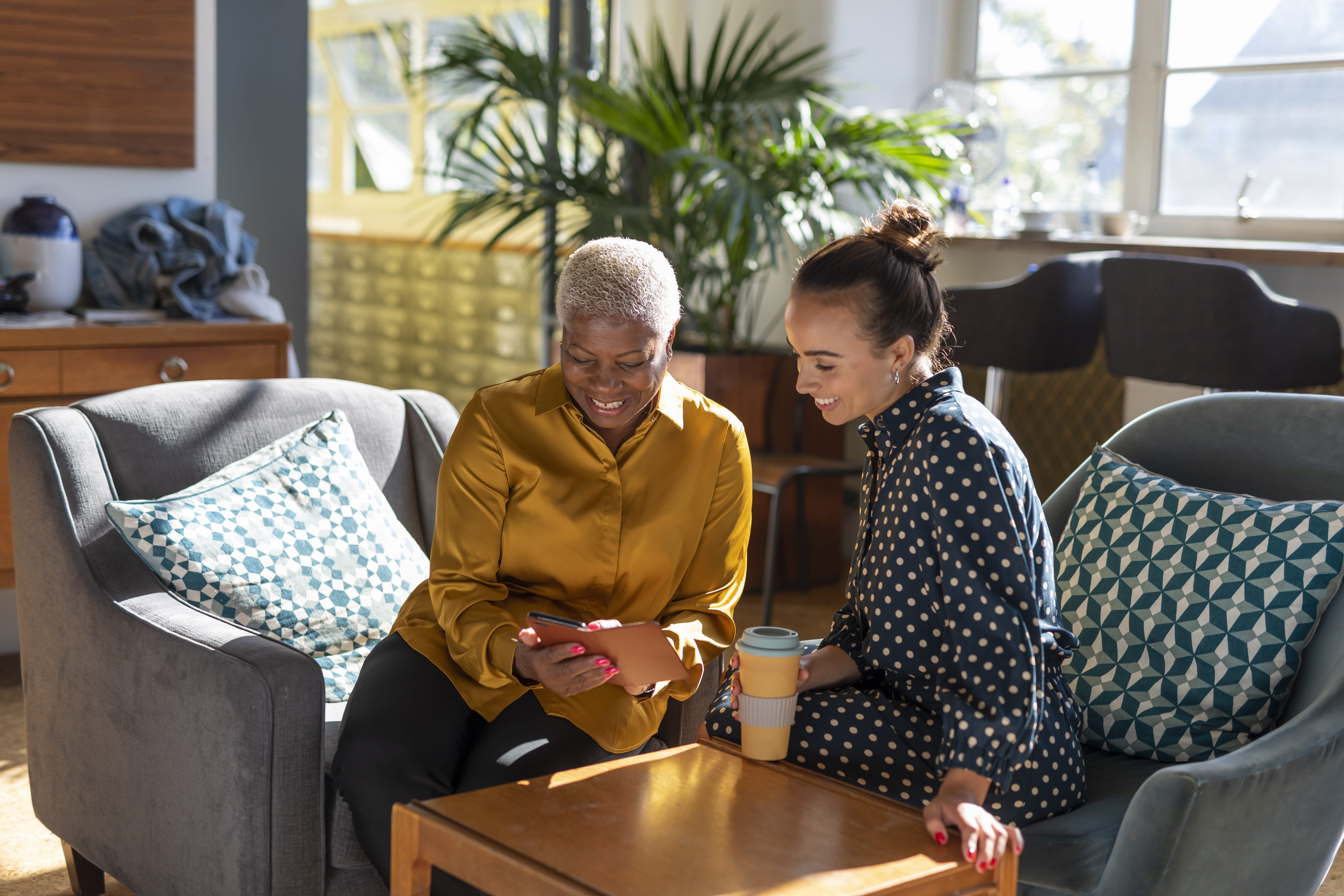 Two women looking at phone