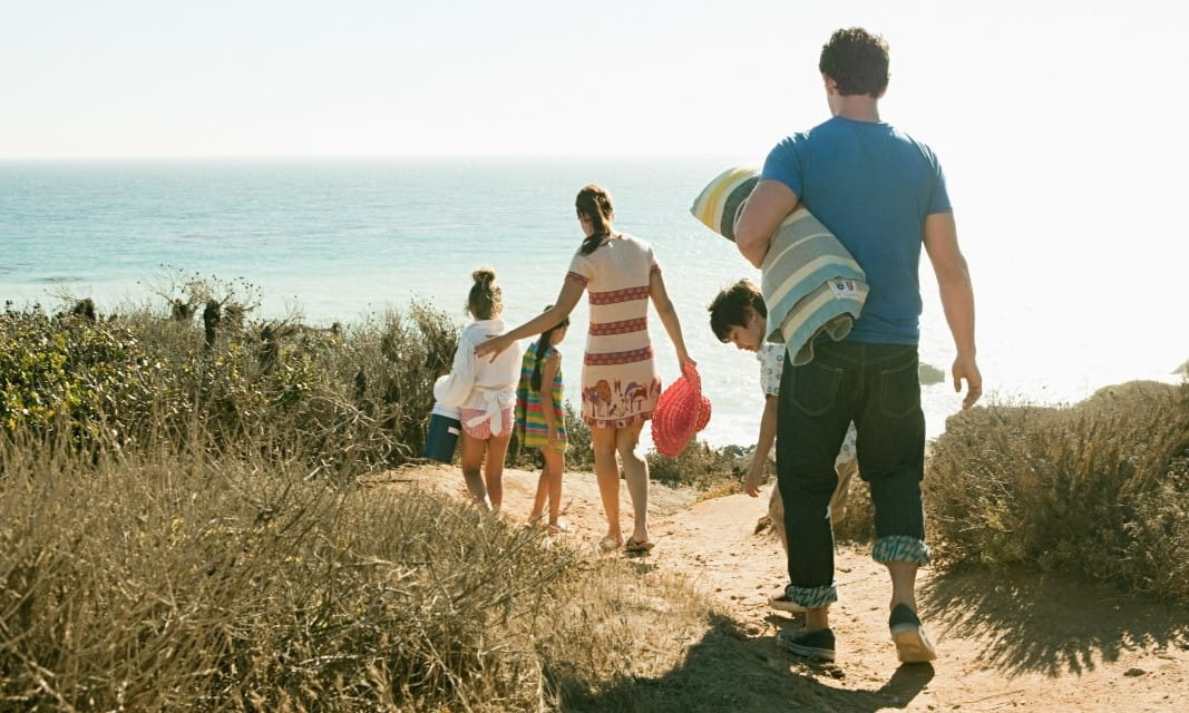 Family walking to beach