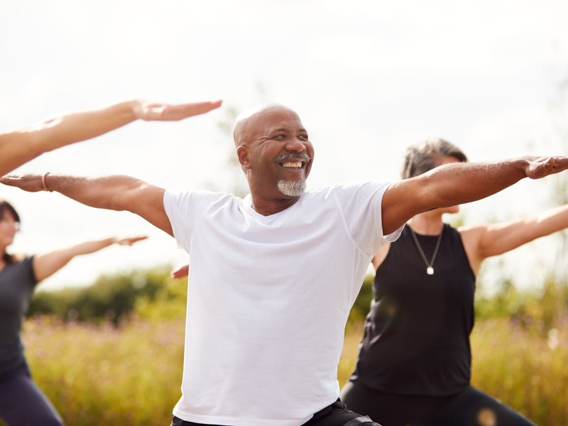 Man doing pilates in field