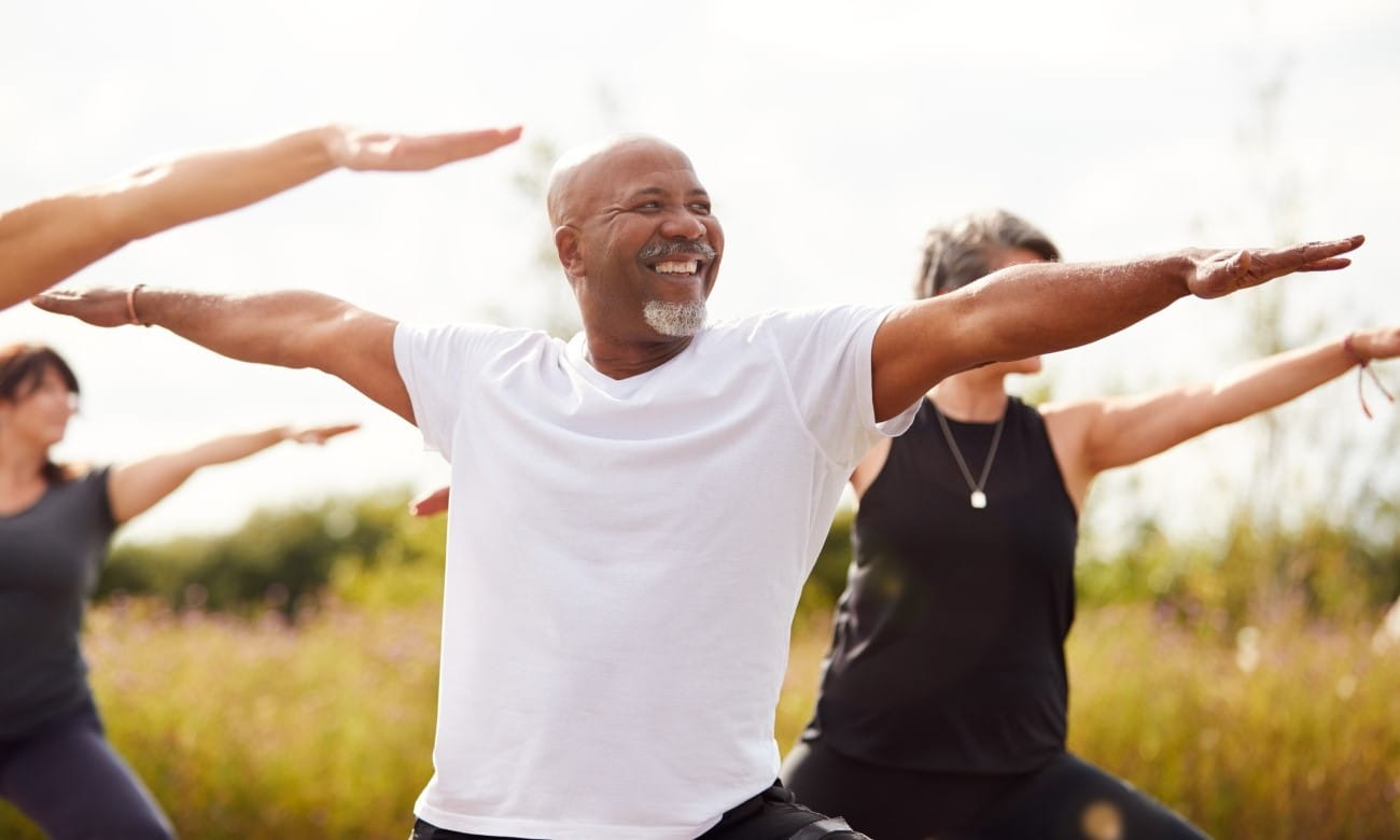 Man in group doing pilates