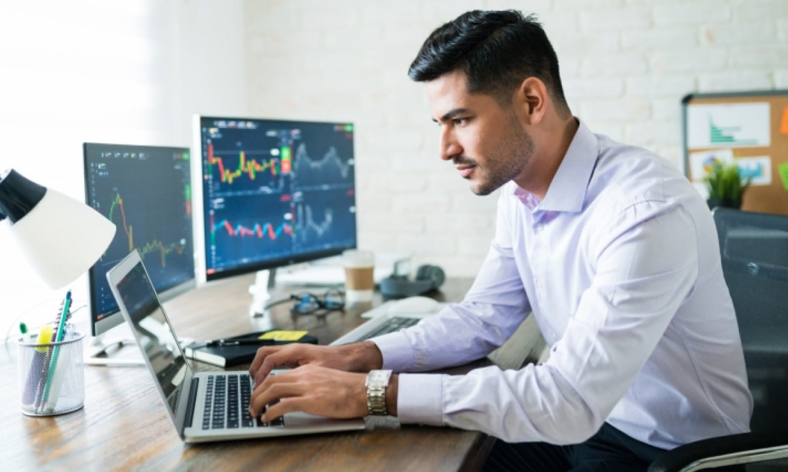 Man using multiple screens