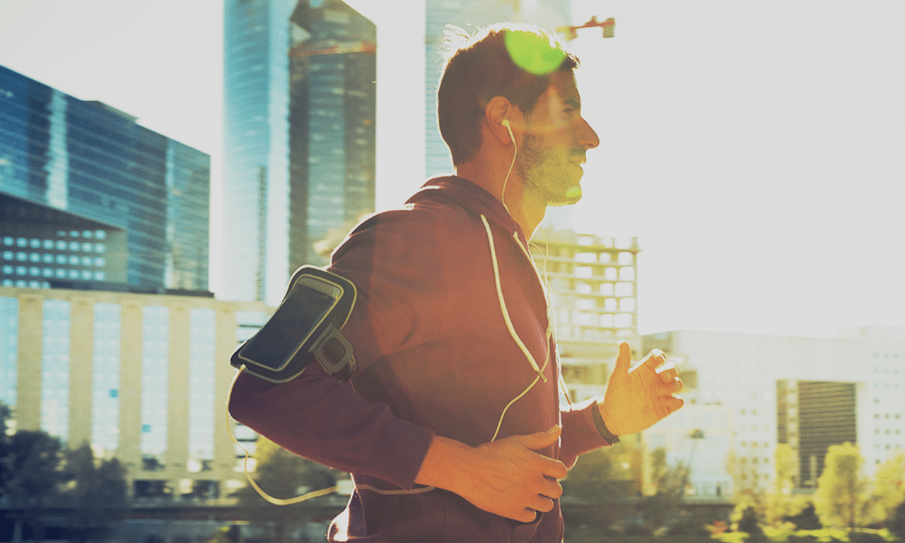 Man running outside in city