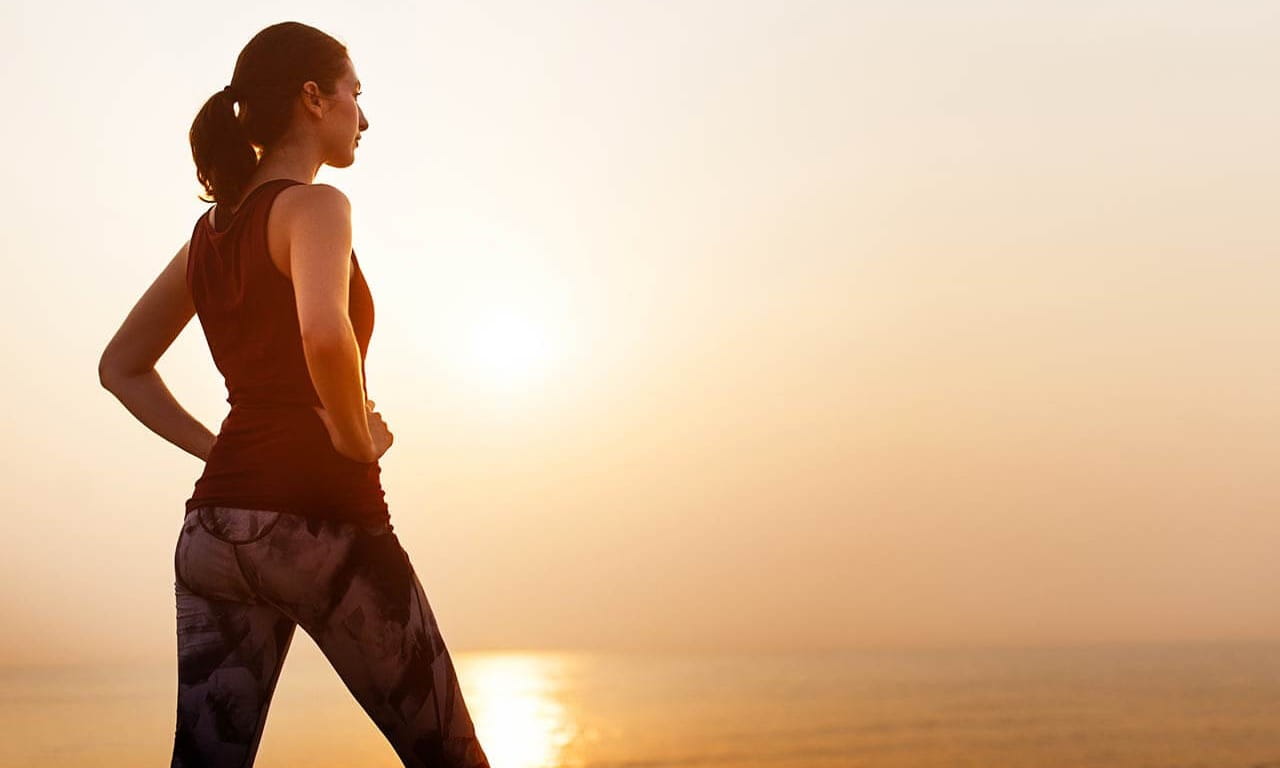 Woman looking out over water