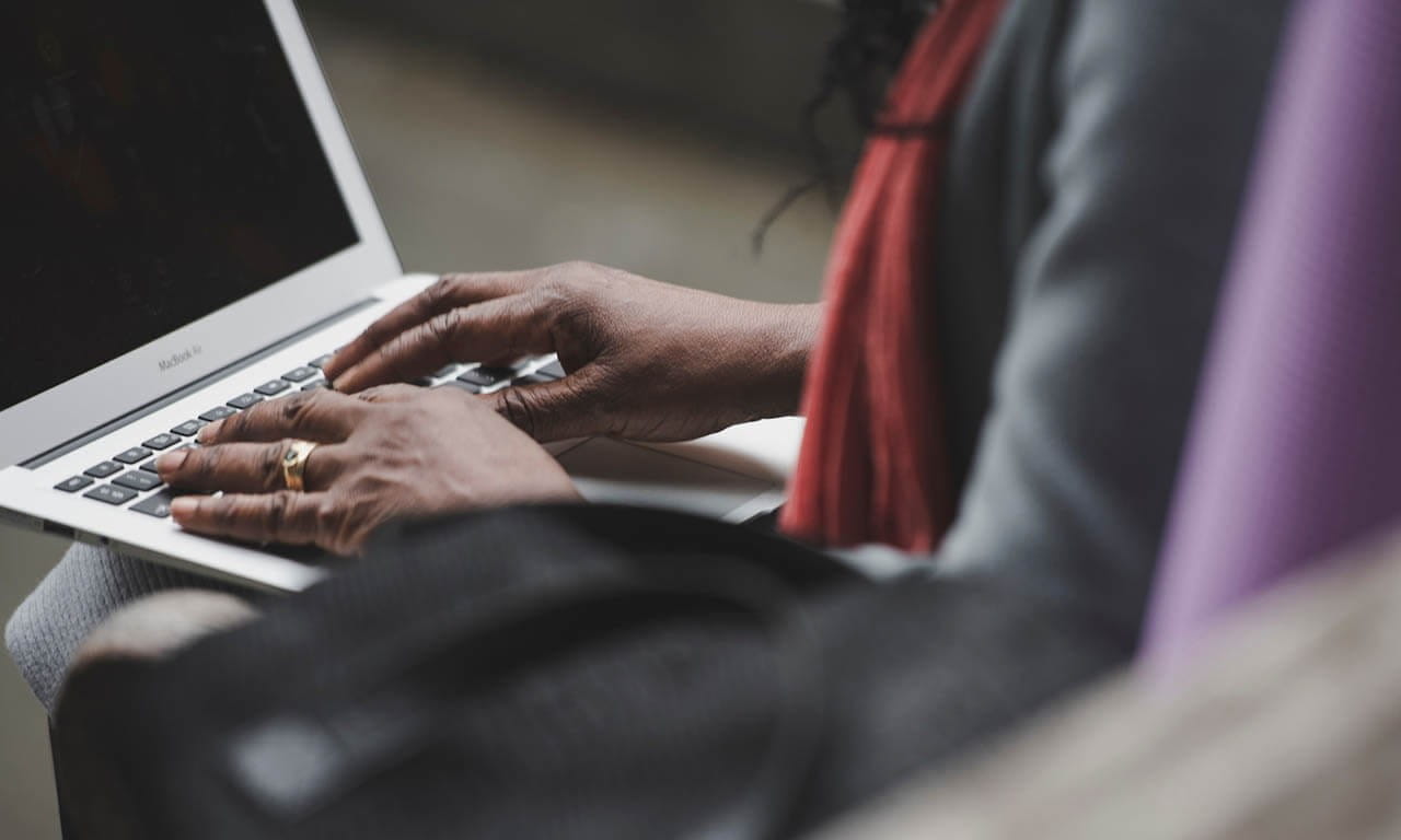 Woman typing on laptop