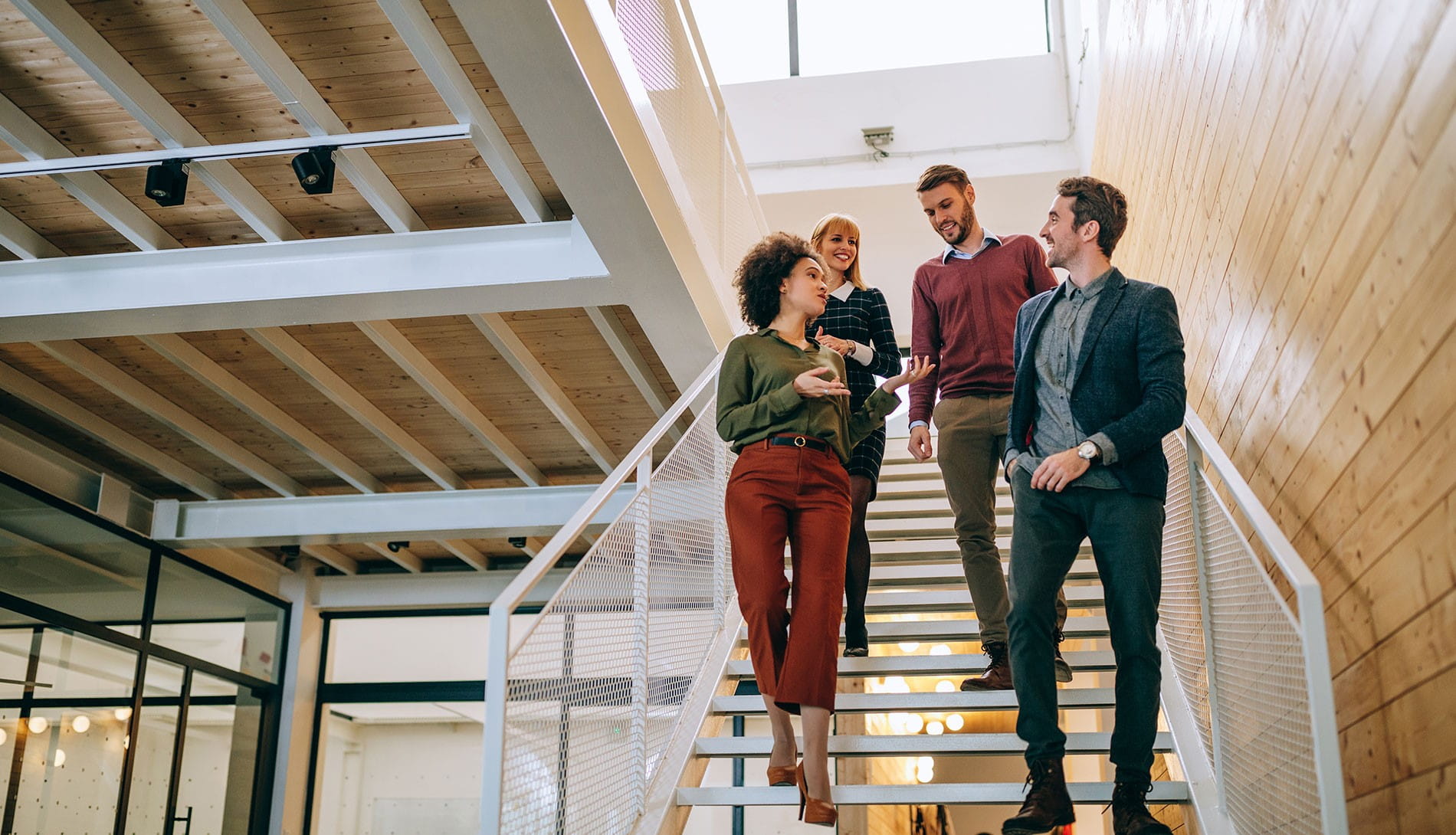 Group of business people walking down stairs