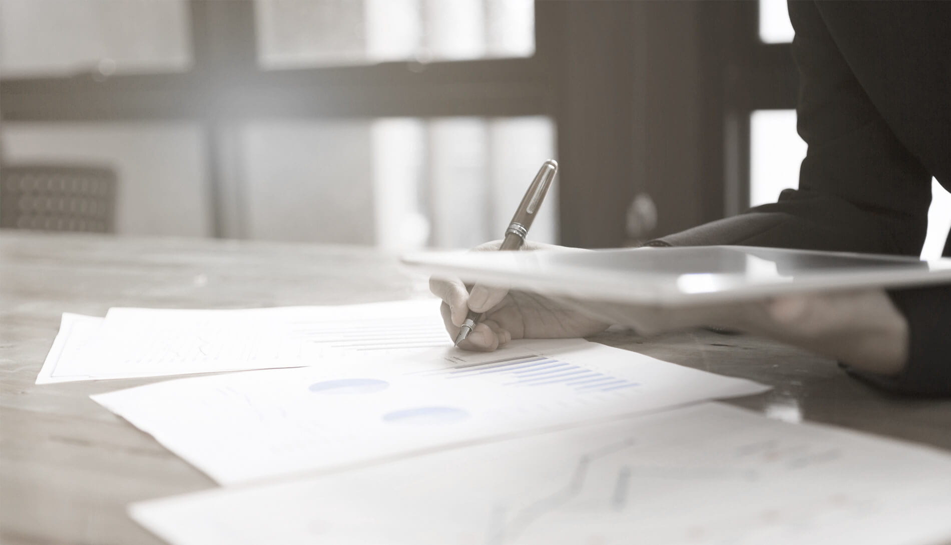 Close-up of person writing on pad