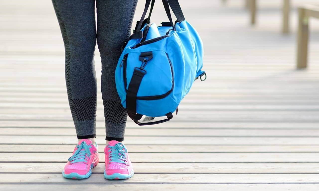 Woman holding a gym bag