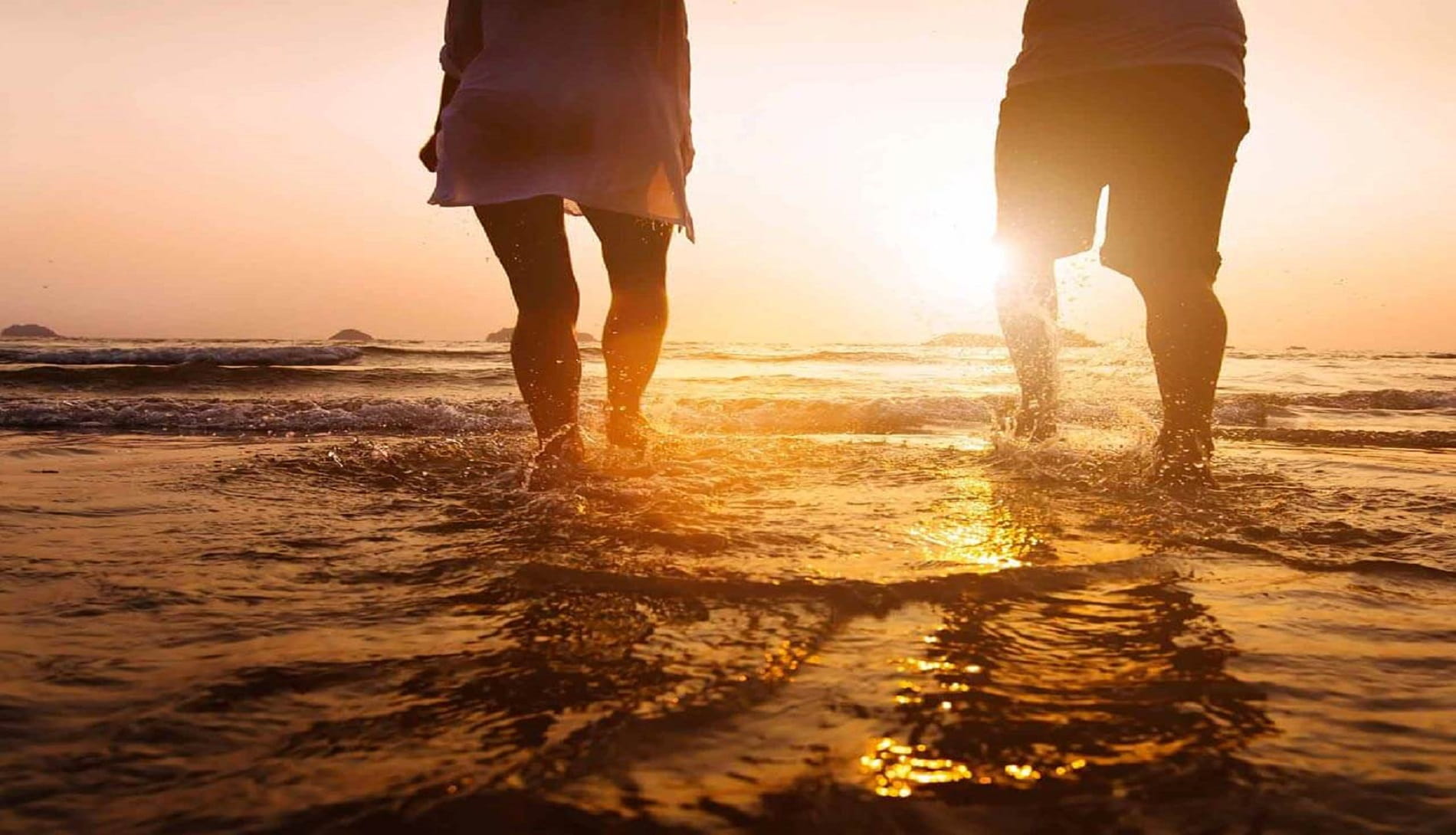 Couple wading beach
