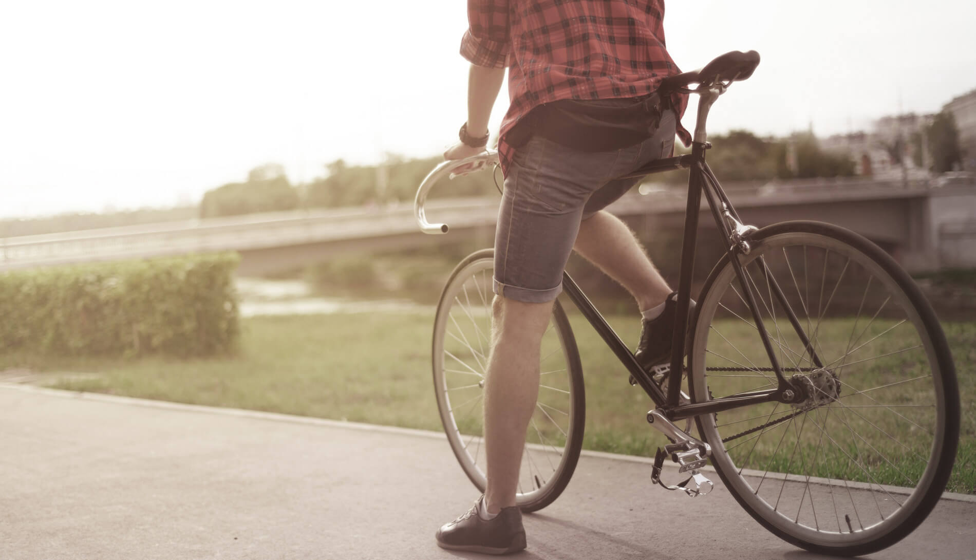 Cyclist resting on path