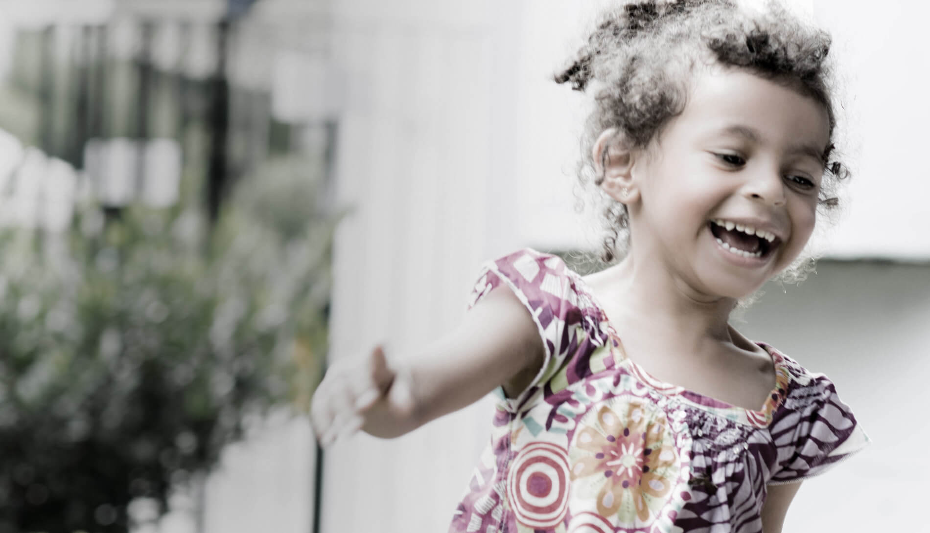 Girl smiling and playing