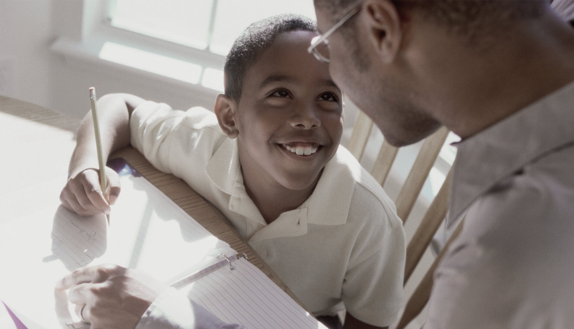 Smiling child studying