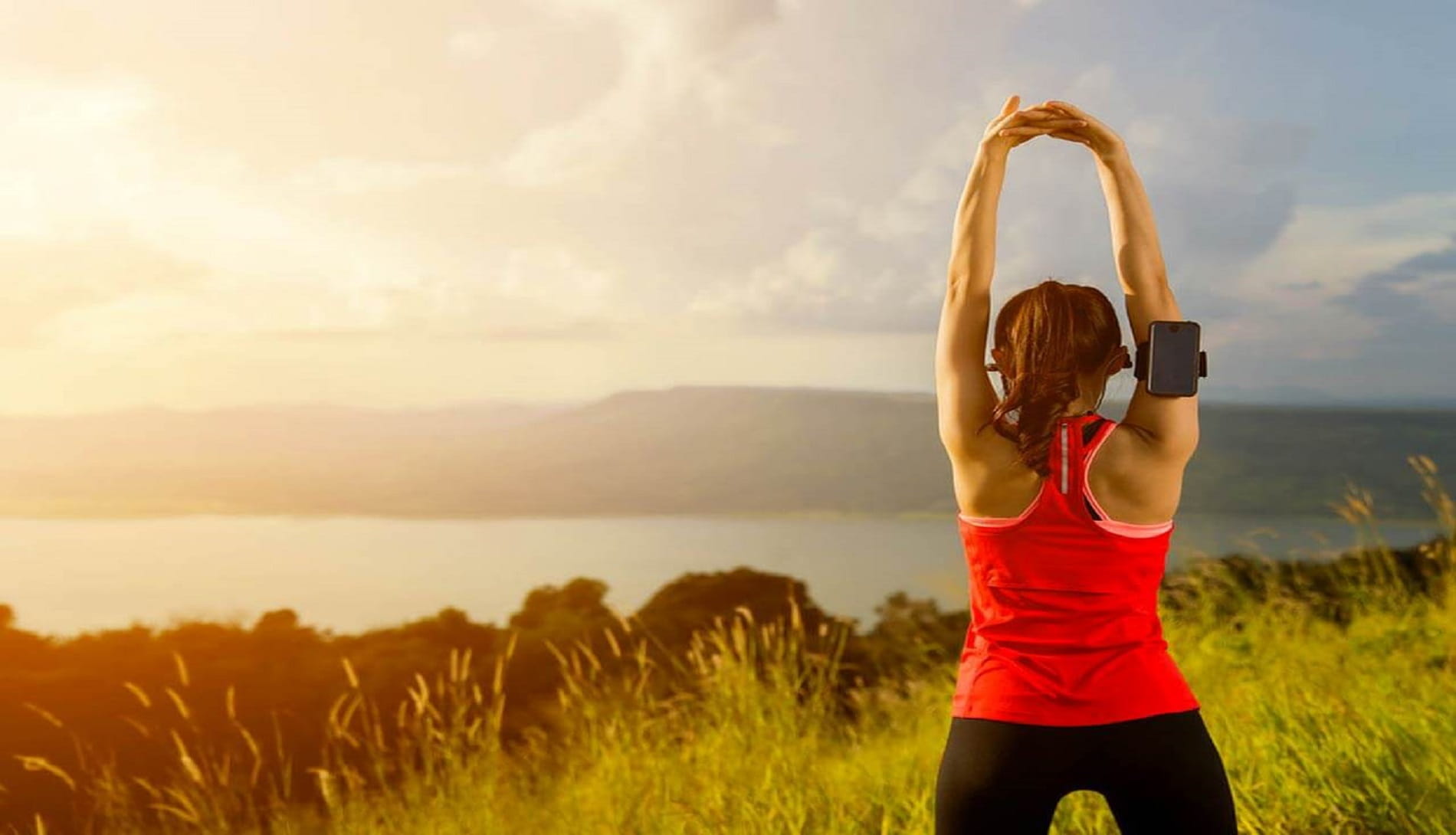 Woman stretching in field