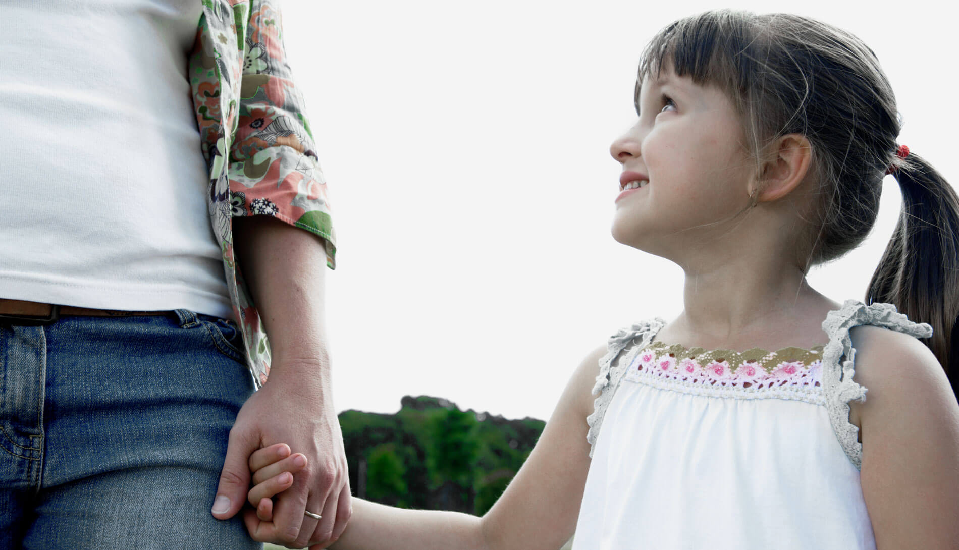 Young girl holding hands