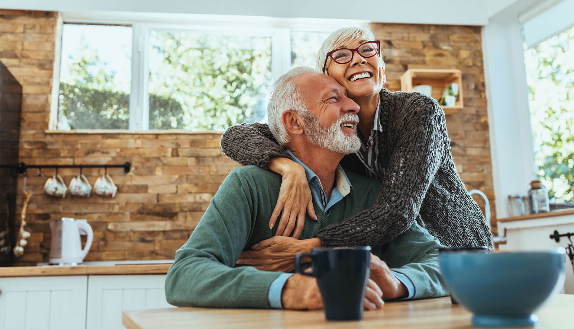 Couple hugging each other in the kitchen